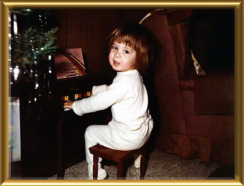 Julie Westfall as a young child at the piano